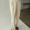 model wearing cream waffle knit pants with elastic waist and side pockets