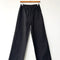 black cotton straight leg work pants on a hanger