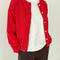 model wearing un-buttoned chili red cotton cardigan