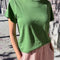 model wearing artichoke relaxed fit tee with a slight crop