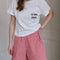 model wearing vintage white relaxed fit tee with 'le bon crew' on the left bust