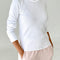 model wearing white pointelle long sleeve tee