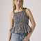 model wearing black and white gingham peplum tank with smocked bust and tie straps