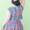 back view of model wearing colorful plaid button front cotton tank