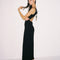 side view of model wearing black crinkle maxi dress with asymmetrical hem and open back