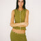 model wearing cropped olive crinkle button front tank with various shaped shell buttons