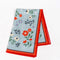 blue tea towel with colorful folk floral print and red trim