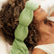 model wearing matcha green weighted eye mask over their eyes