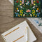the farm fresh weekly meal planner & market list with colorful fruit and floral print cover with interior pages showing