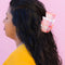 model wearing pink and white stacked 'pyrex' bowl inspired hair claw