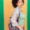 model carrying pink, blue, blue and yellow granny square printed shopping bag