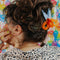 model wearing orange scissors hair claw