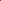 arroyo oak standard candle in a amber colored jar and gold twist lid burning on a table