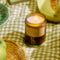 cut grass special standard candle lit on a picnic blanket