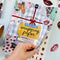 model flipping through wrapping paper book