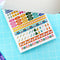 model showing interior sticker pages of pretty planner stickers book