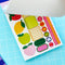 model showing interior sticker pages of pretty planner stickers book with oversized fruit stickers