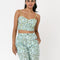 model wearing mint cropped tank with dainty blueberry vine print and wide leg pants