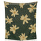 green throw blanket with yellow flower print with smiley faces in the center