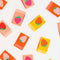 scattered set of 8 multicolor sewing labels with a strawberry in the center