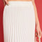 up close of model wearing white pleated midi skirt