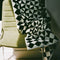 black and white geometric bath towel on a chair