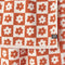 up close of rust and cream checkered flower hand towel
