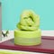 citron green calming putty on a desk