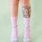 model wearing pink scalloped socks with glittery silver star print