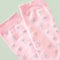 up close of pink scalloped socks with glittery silver star print