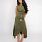 model wearing green midi dress with handkerchief hem and strategically placed starfish and seashell designs 