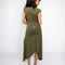 back view of model wearing green midi dress with handkerchief hem and strategically placed starfish and seashell designs 