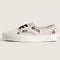 side view of cream authentic sneakers with black embroidered floral and checkered pattern