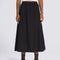 model wearing flowy black midi skirt
