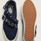 top and bottom view of navy strappy mary jane shoes with grommet details
