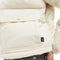 up close of model wearing cream cropped  puffer jacket
