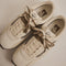 pair of vans super low pro with brown, beige and cream with brown wraparound laces