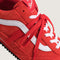 up close of red vans super low pro trainer sneakers with white accents with red laces