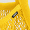 up close of bright yellow mesh bag