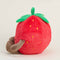 side view of smiley strawberry warmies heating plush