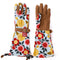 light blue arm saver gardening gloves with colorful floral print and brown textured design with matching buckle around the wrist