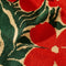 up close of tan terry cloth towel with large orange abstract flowers