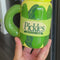 model showcasing pickle jar mug with pickles inside