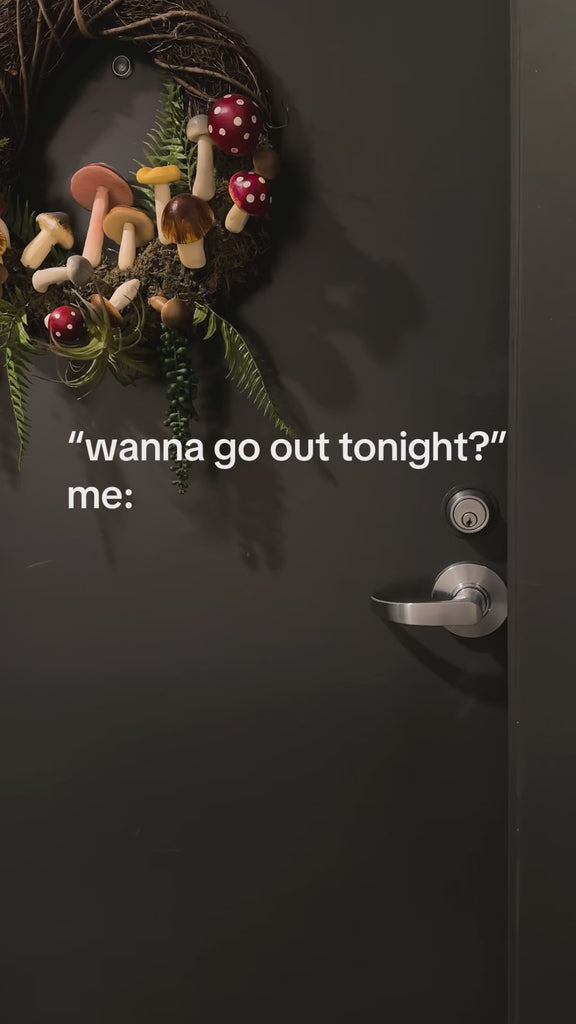 model putting blue and red book theme door hanger bookmarks on their door