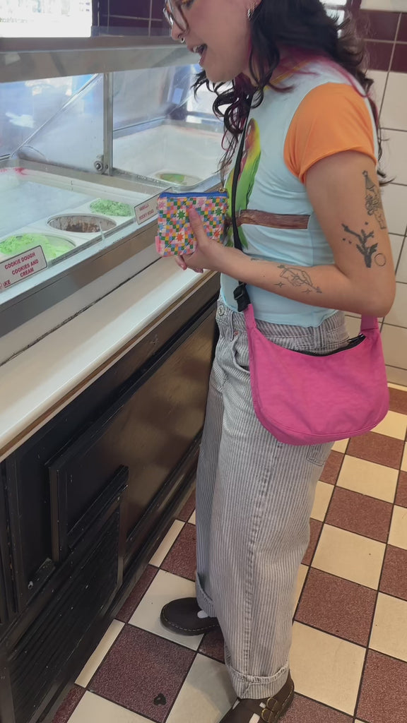 model using colorful star checker coin purse to buy ice cream