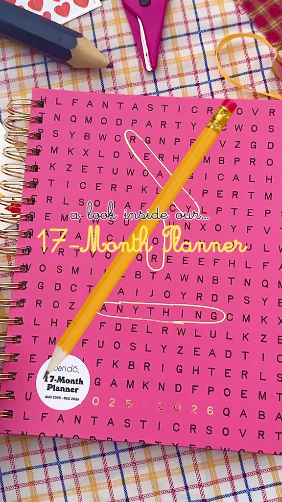 model showing the interior contents of large planner with pink cover and word search design