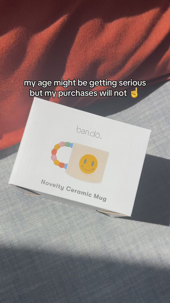 model showcasing smiley mug and red heart trinket holder