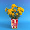 spinning popcorn vase with flowers inside