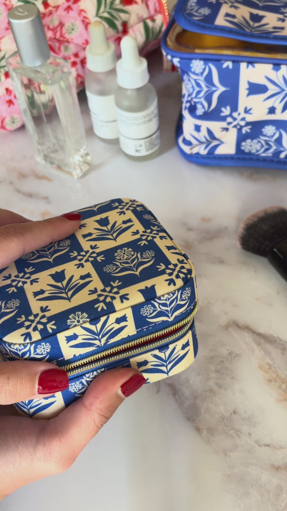 model filling blue and white folk print jewelry organizer with jewelry inside
