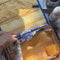 model filling blue and yellow travel bag